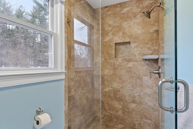 full bath featuring a shower stall