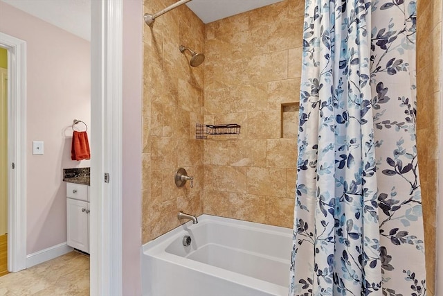 full bathroom featuring baseboards, shower / bathtub combination with curtain, vanity, and tile patterned floors