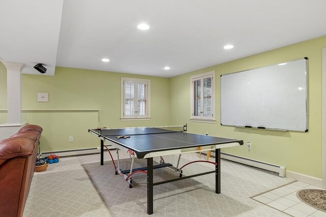 rec room with baseboards, baseboard heating, recessed lighting, and ornate columns