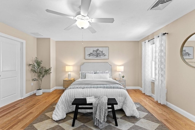 bedroom with wood-type flooring and ceiling fan