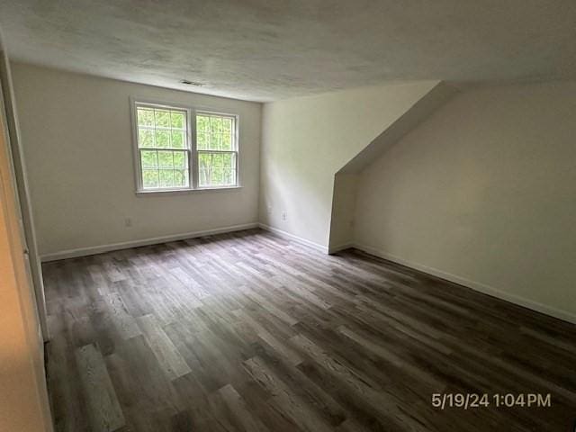 bonus room featuring dark hardwood / wood-style flooring