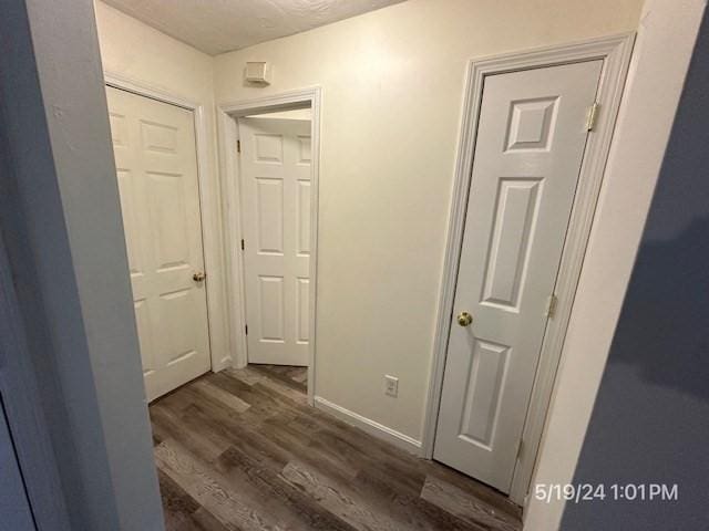 hall with dark hardwood / wood-style floors