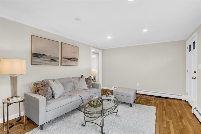 living room featuring hardwood / wood-style floors and baseboard heating