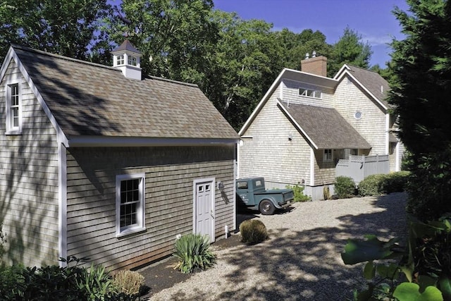 view of property exterior featuring a chimney