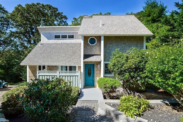 view of front facade with a shingled roof