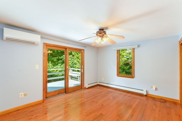 spare room featuring a baseboard radiator, ceiling fan, hardwood / wood-style flooring, and a wall mounted air conditioner