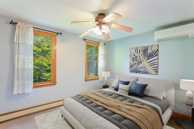 bedroom with a baseboard radiator, a wall unit AC, and a ceiling fan