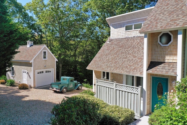 view of side of property with a garage