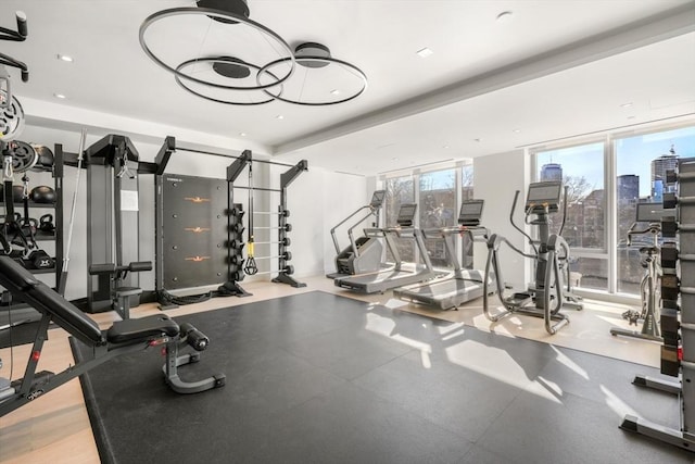 gym featuring floor to ceiling windows