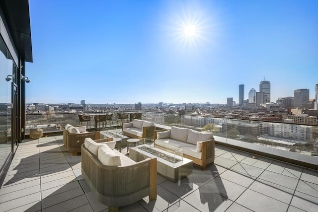 view of patio / terrace with an outdoor living space with a fire pit