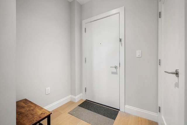 foyer entrance with light hardwood / wood-style flooring