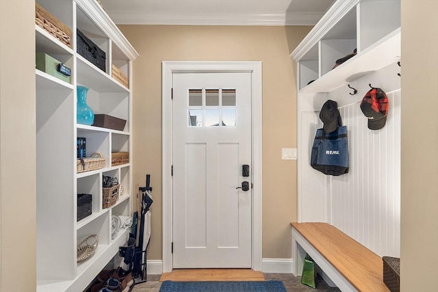 mudroom with wood finished floors, baseboards, and ornamental molding