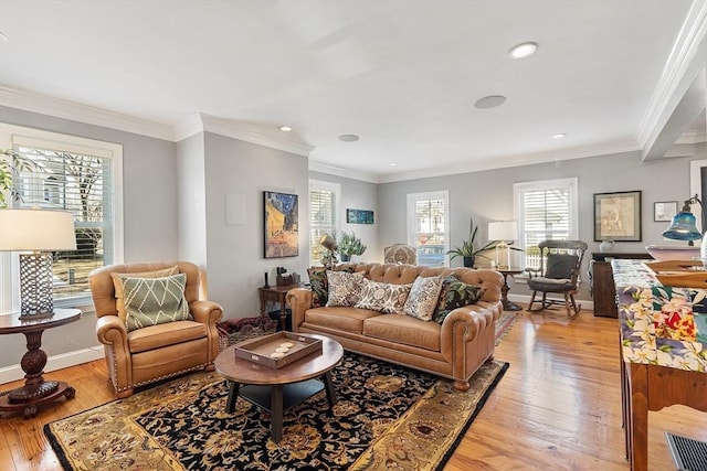 living room with recessed lighting, light wood-style floors, baseboards, and ornamental molding