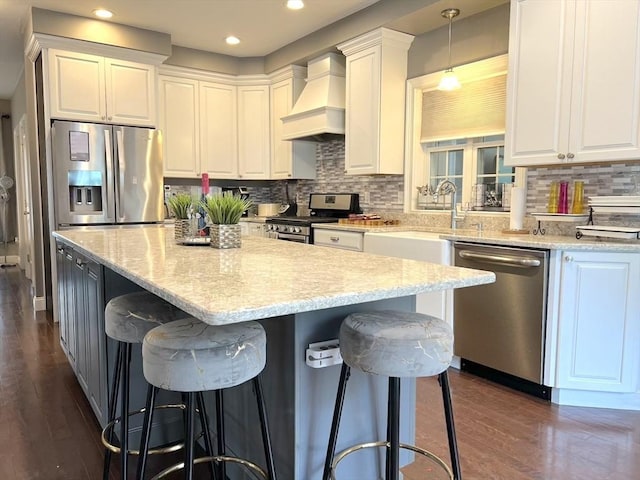 364 Chestnut Hill Rd, Millville, MA 01529 - kitchen with stainless steel appliances, custom range hood, white cabinetry, and recessed lighting