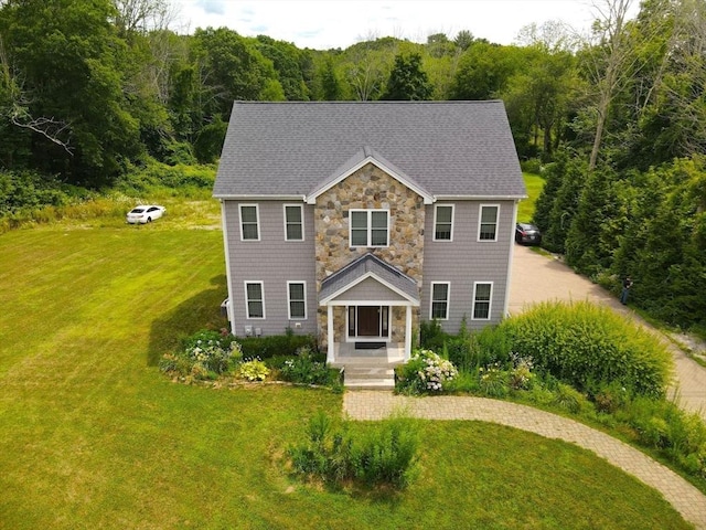 364 Chestnut Hill Rd, Millville, MA 01529 - view of front facade with a front lawn, stone siding, a view of trees, and roof with shingles