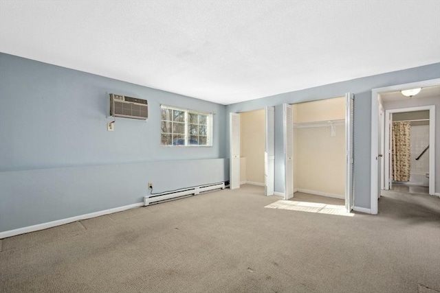 unfurnished bedroom with a wall mounted air conditioner, two closets, a baseboard heating unit, and light colored carpet