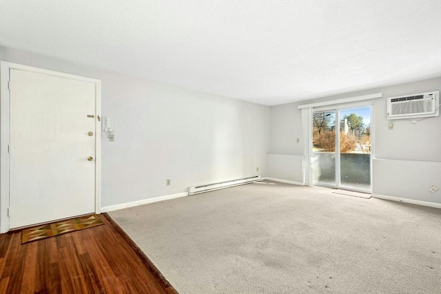 unfurnished room featuring a baseboard radiator, carpet flooring, and a wall mounted AC