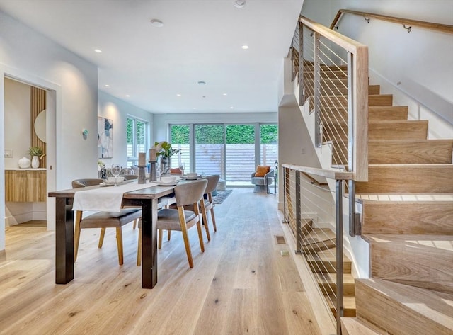 dining space with light wood-type flooring