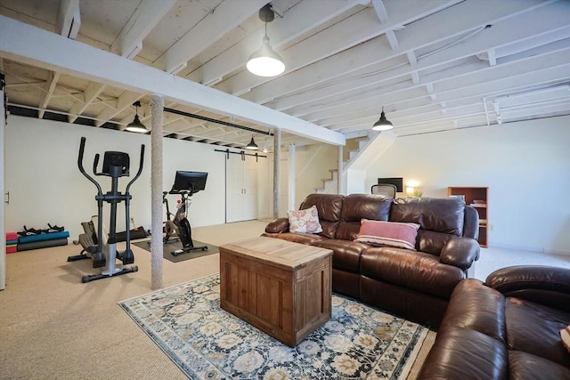 living area with carpet floors and stairway