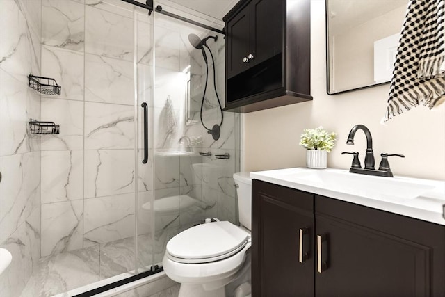 37 Symphony Rd Unit B, Boston, MA 02115 - bathroom featuring vanity, a marble finish shower, and toilet