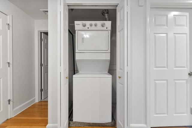 37 Symphony Rd Unit B, Boston, MA 02115 - laundry area with stacked washer / drying machine, wood finished floors, and baseboards