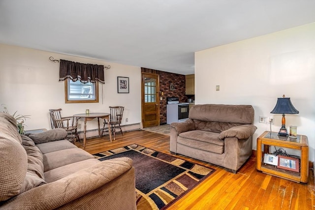 15 Winslow St, Gardner, MA 01440 - living area featuring a baseboard radiator and wood-type flooring
