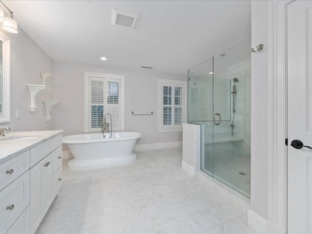 bathroom with separate shower and tub and vanity