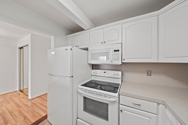 kitchen featuring light wood finished floors, baseboards, light countertops, white appliances, and white cabinetry