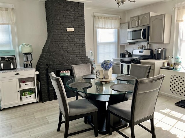 dining space featuring crown molding