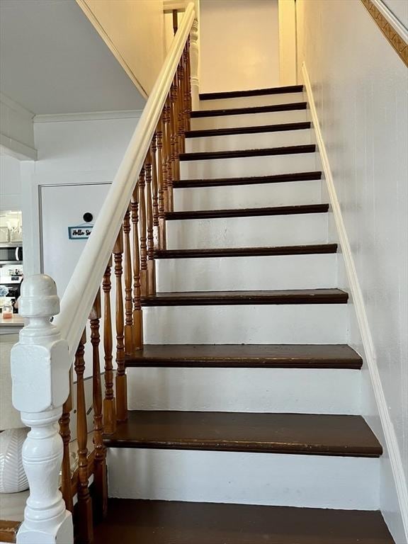 stairway with crown molding