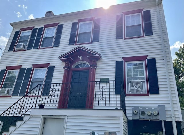 view of front of house featuring cooling unit