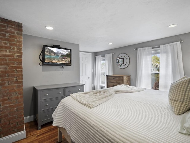 bedroom with baseboards, recessed lighting, dark wood-style floors, and access to outside