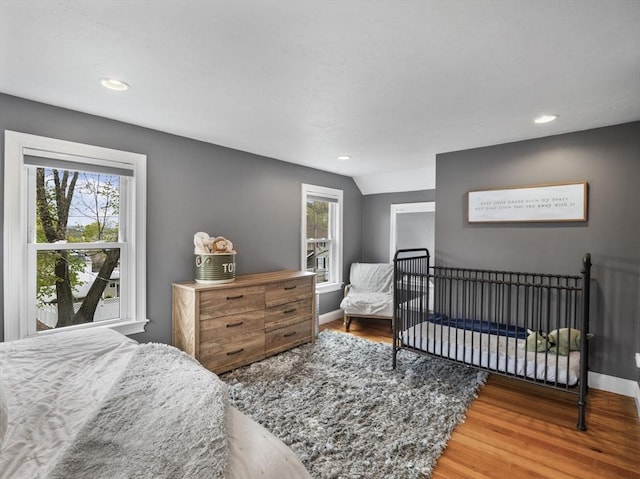 bedroom featuring recessed lighting, baseboards, and wood finished floors
