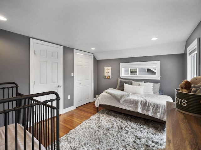 bedroom featuring recessed lighting, baseboards, and wood finished floors