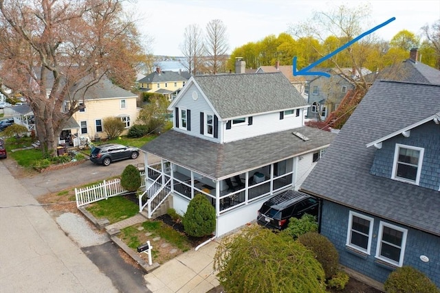 birds eye view of property with a residential view