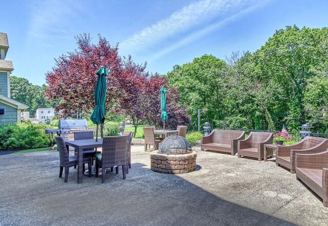 59 Walpole St Unit 202, Canton, MA 02021 - view of patio / terrace featuring a fire pit, area for grilling, and outdoor dining space
