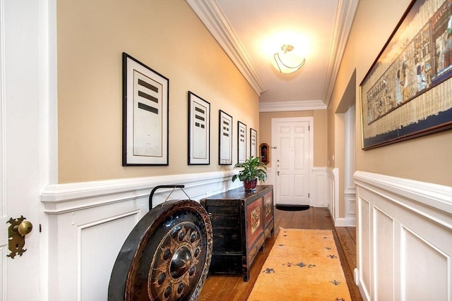 entryway with dark hardwood / wood-style floors and ornamental molding