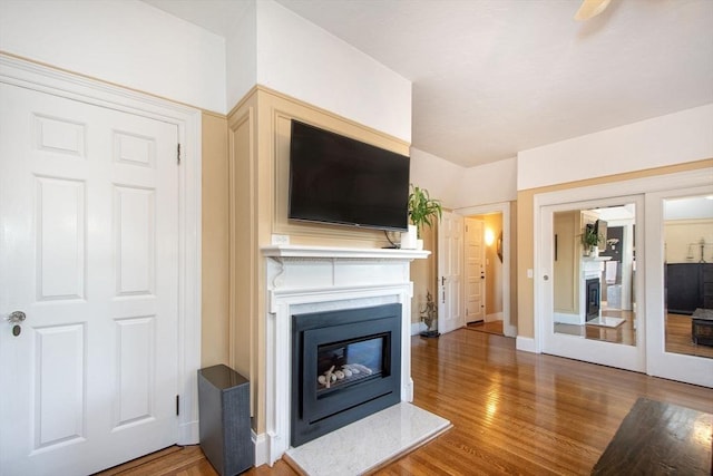 unfurnished living room featuring hardwood / wood-style floors