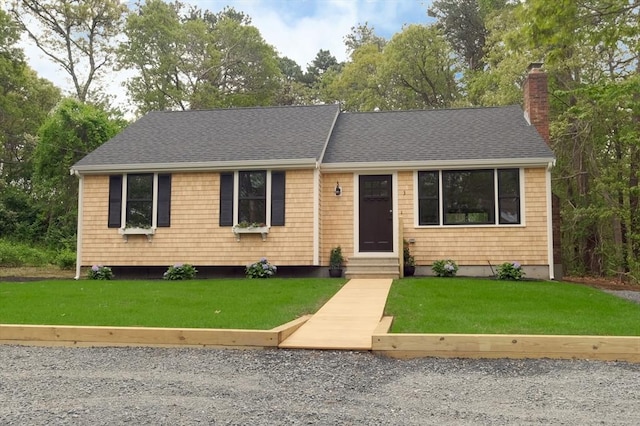 3 Gilbert Ln, Harwich, MA 02646 - view of front of home featuring entry steps, a chimney, roof with shingles, and a front yard