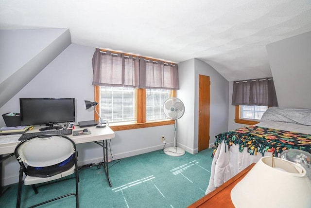 bedroom with vaulted ceiling, baseboards, and carpet floors