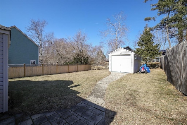 view of yard featuring an outdoor structure and a fenced backyard