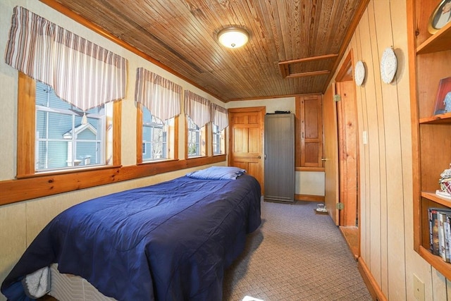 bedroom with carpet, wood ceiling, and wood walls