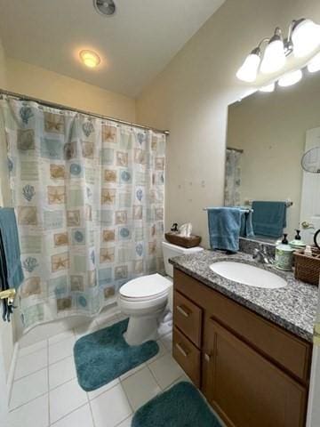 bathroom with curtained shower, tile patterned flooring, vanity, and toilet