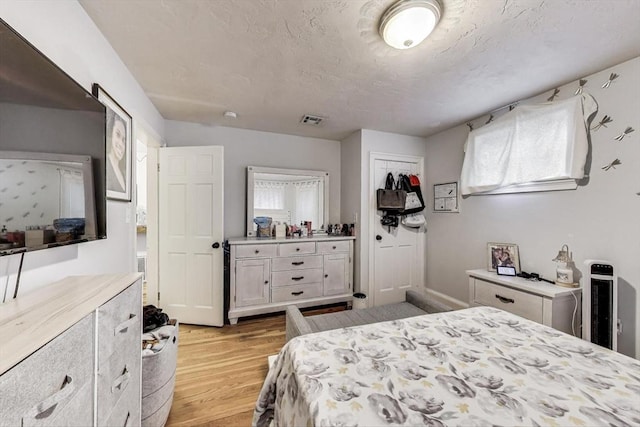 15 Ronan St Unit 3, Boston, MA 02125 - bedroom with light wood-style flooring and multiple windows