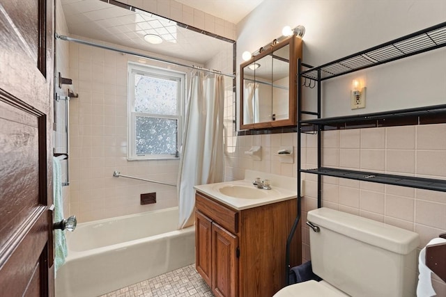 12 Leonard St, Somerville, MA 02144 - bathroom with tile walls, shower / bath combo with shower curtain, vanity, and tile patterned floors