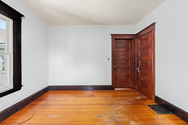 12 Leonard St, Somerville, MA 02144 - spare room featuring hardwood / wood-style floors and ornamental molding