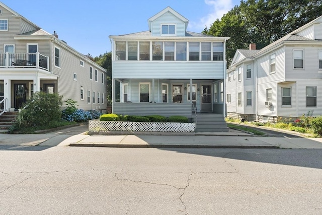 12 Leonard St, Somerville, MA 02144 - view of front of house featuring a sunroom and covered porch