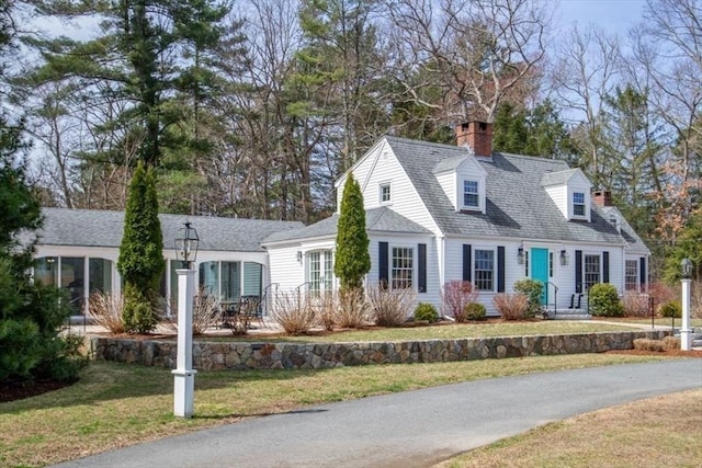 279 Norfolk St, Holliston, MA 01746 - cape cod-style house featuring a front lawn and a chimney