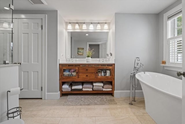 279 Norfolk St, Holliston, MA 01746 - bathroom featuring double vanity and a freestanding tub