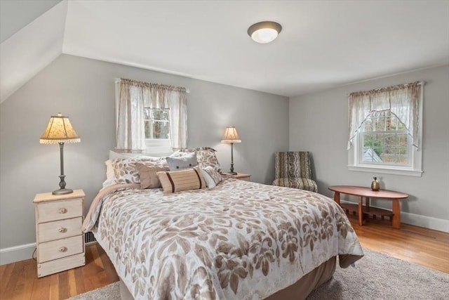 279 Norfolk St, Holliston, MA 01746 - bedroom featuring multiple windows, wood finished floors, and lofted ceiling